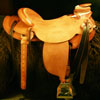 Douglas 38 Wade - tree by Rick Reed, 15 and 1/4 inch seat, Gullet - 7 and 1/2 inch by 6 and 1/4 inch by 4 inch, Horn  3 inch round, 90 degree bars, 7/8ths flat palte riggin, Cheyenne Roll, Sheridan Style Floral Carving bordered with Vaquero Lace.